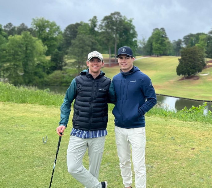 Matt and Tanner together on a golf course